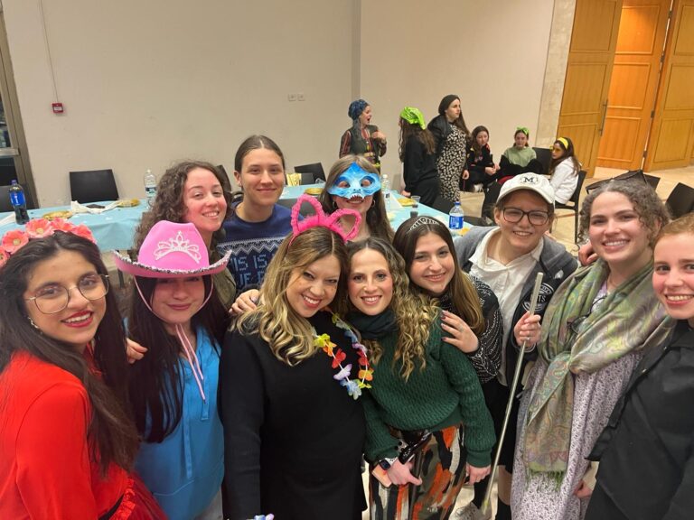 Smiling group wearing costumes and party accessories