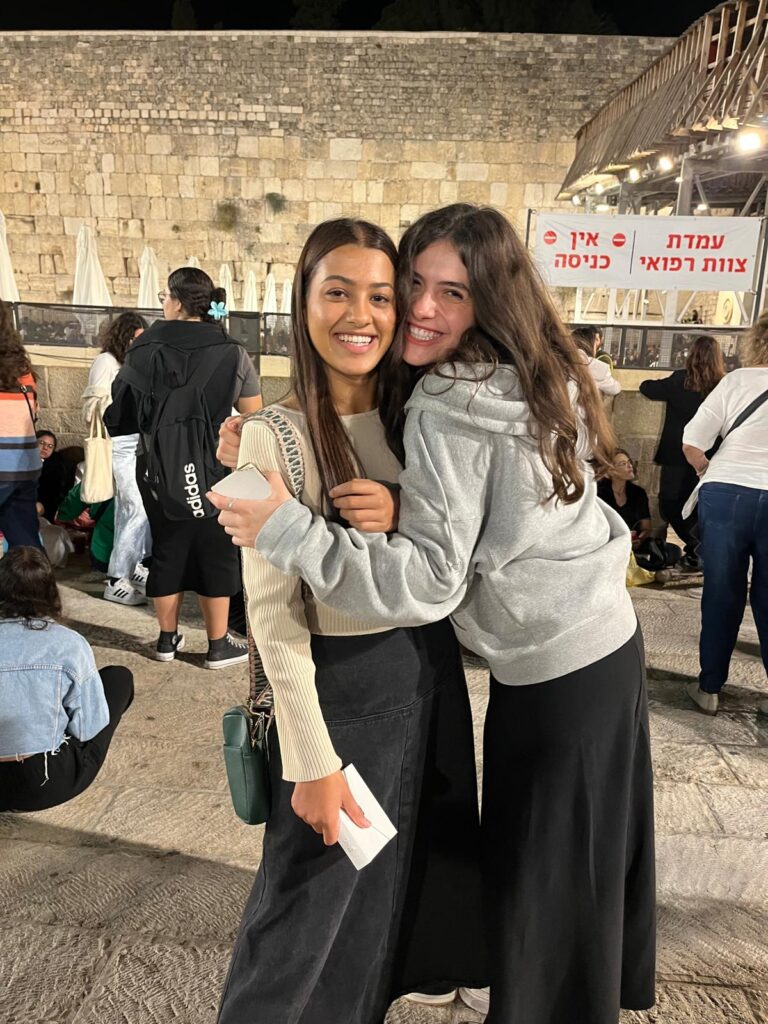Two women hugging at Western Wall