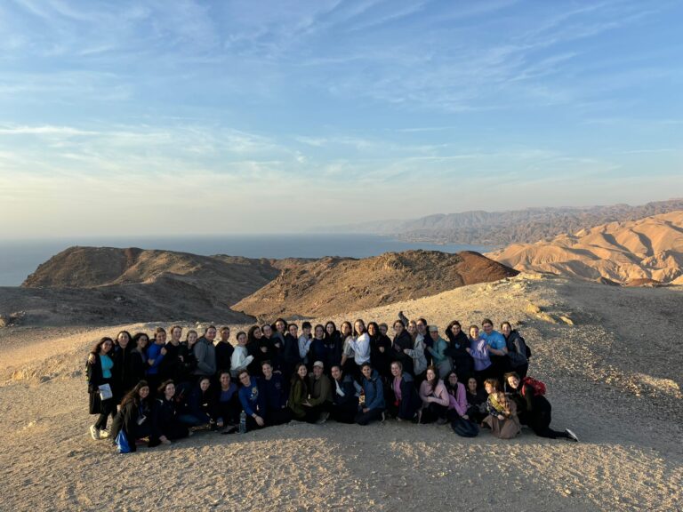 Large group of people on desert ridge