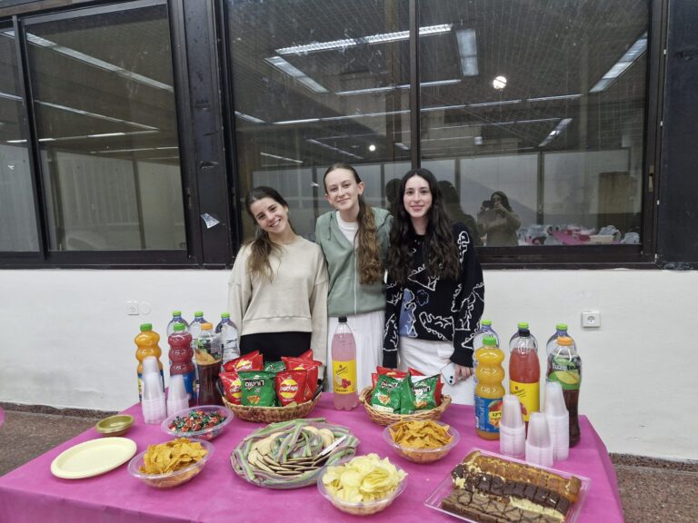 Three women at snack table with drinks