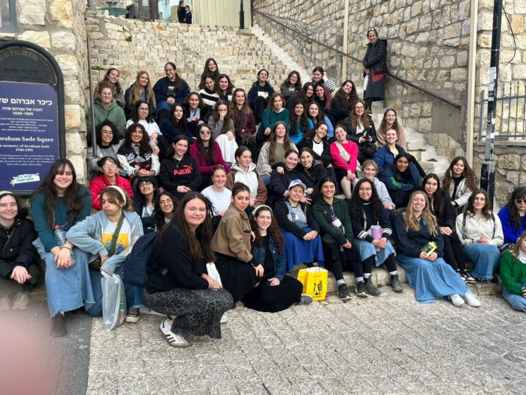 Large group of young women on stone steps