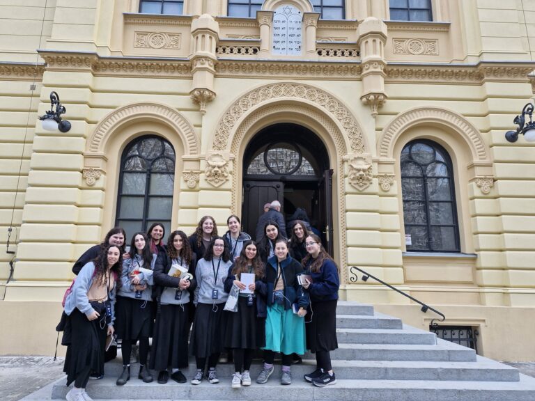 Group of students at historic building entrance