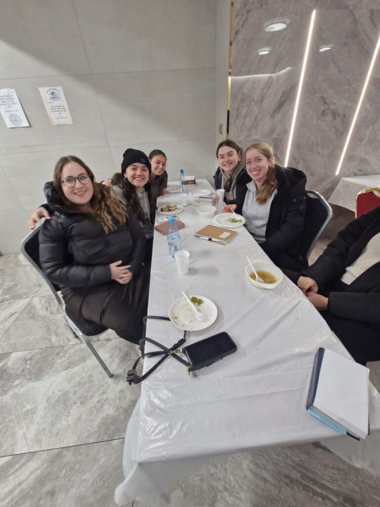 Group of friends sharing a meal at table