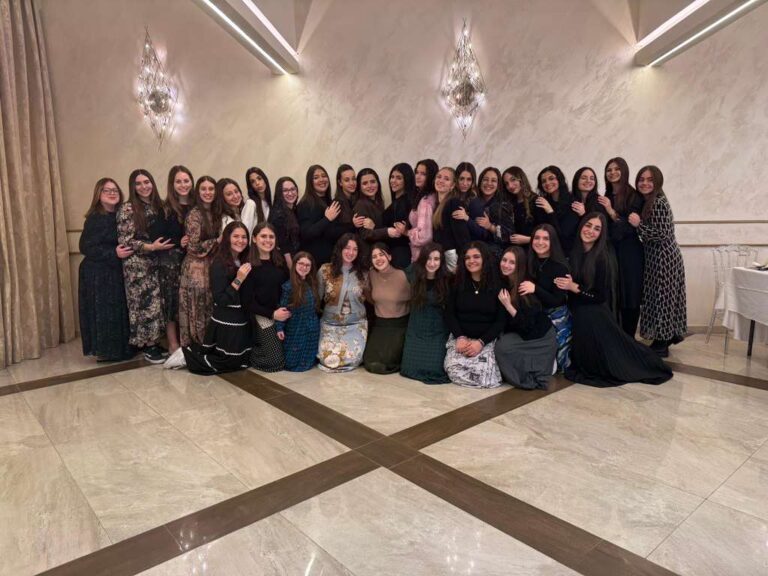 Large group of women posing indoors
