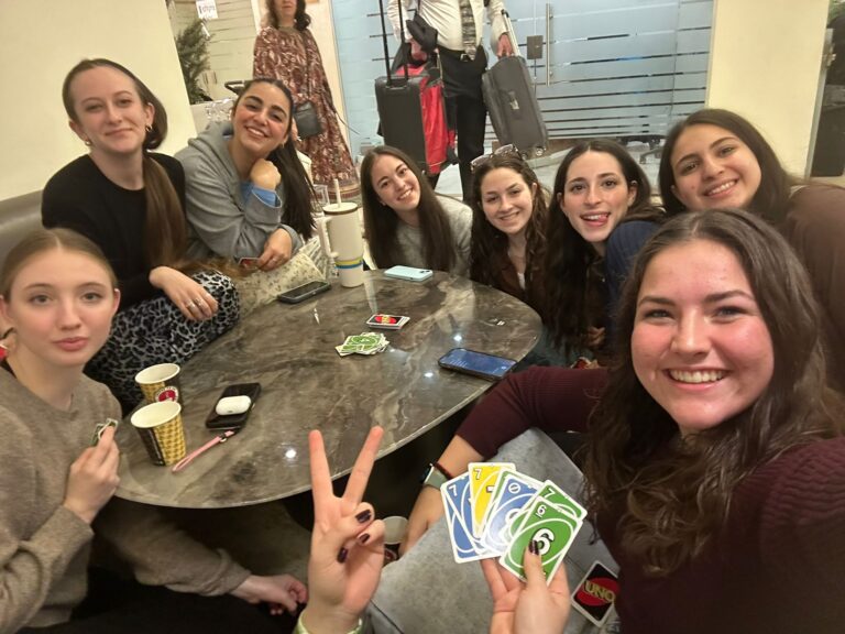 Selfie of friends playing UNO at table