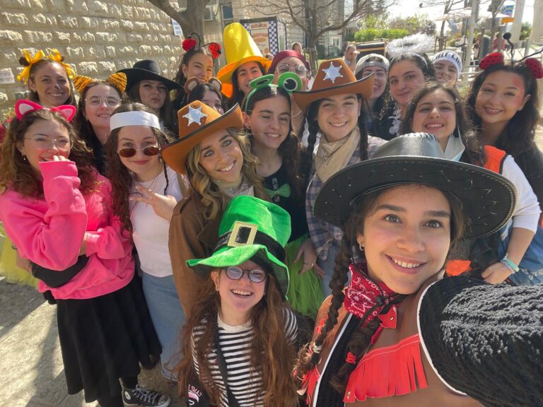 Group selfie of people in colorful costumes